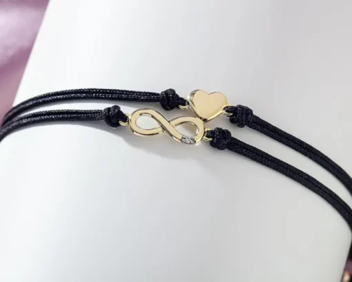 Bransoletka z elementami żółtego złota i diamentem - nieskończoność, serce - 0,004 ct - próba 375
