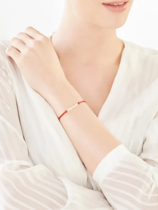 Bransoletka z elementami żółtego złota i diamentem - serce - 0,004 ct - próba 375