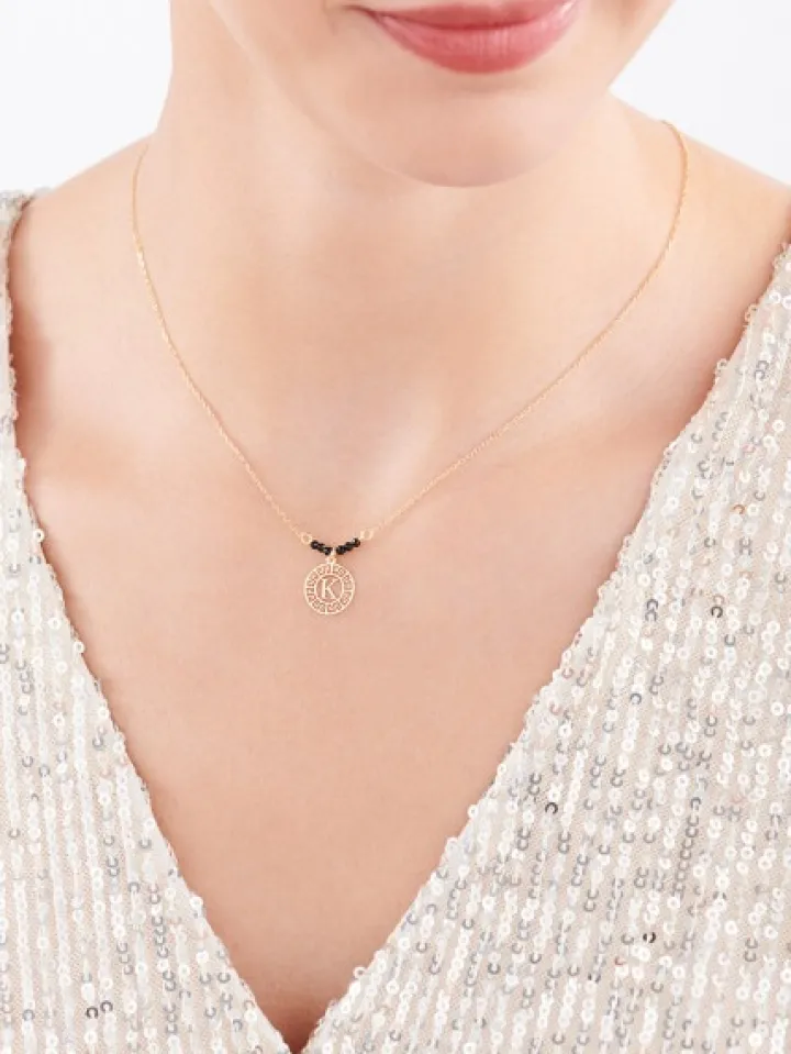 Naszyjnik srebrny ze szlifowanym szkłem - litera K, rozeta