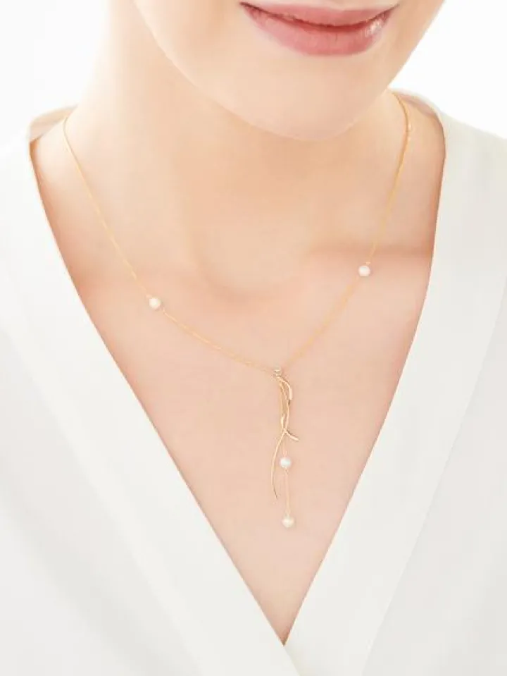 Naszyjnik z żółtego i białego złota z brylantem i perłami - próba 375