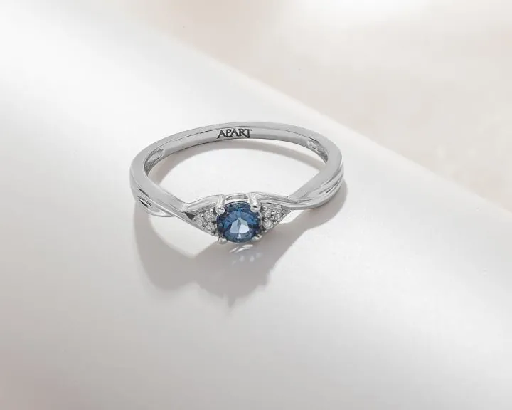 Pierścionek z białego złota z diamentami i topazem London Blue - próba 375