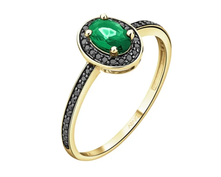 Pierścionek z żółtego złota z czarnymi brylantami i szmaragdem syntetycznym - próba 375