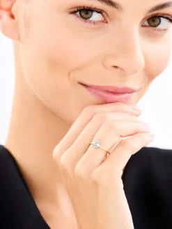 Pierścionek z żółtego złota z brylantami i topazem - próba 375