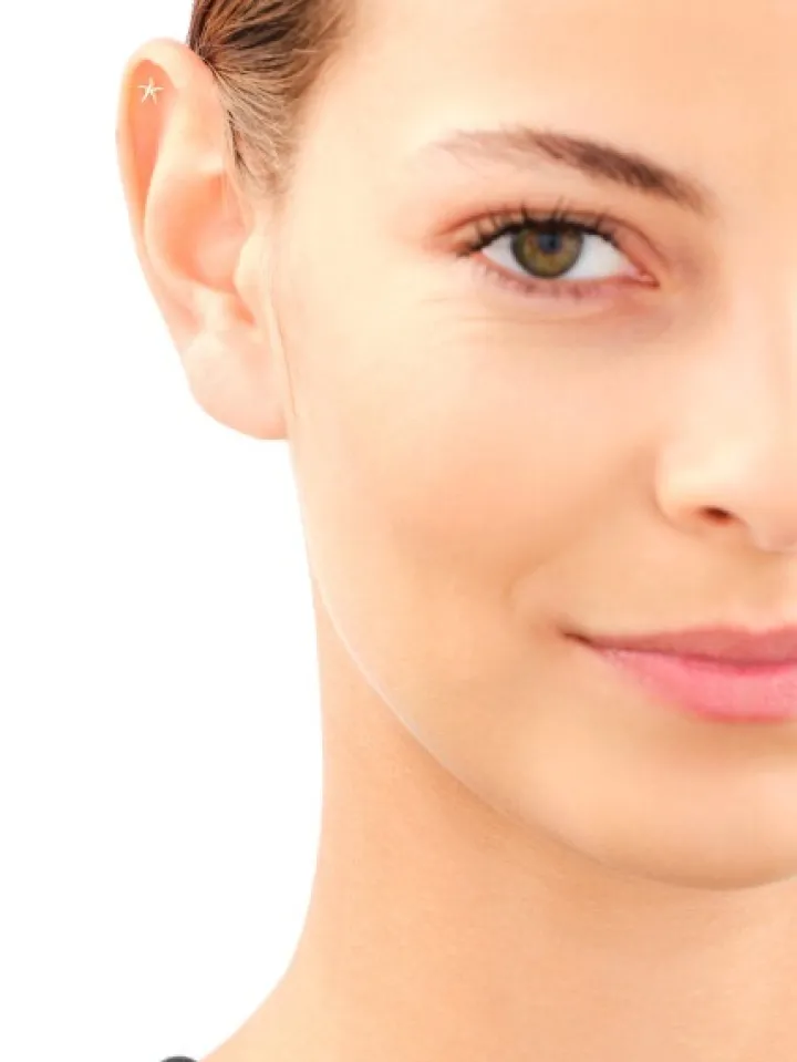 Pojedynczy złoty kolczyk do piercingu - rozgwiazda