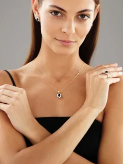 Zawieszka z żółtego i białego złota z brylantami i szafirem - próba 585