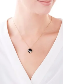 Zawieszka z żółtego złota z diamentami i onyksem - próba 585