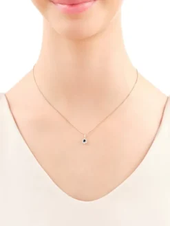 Zawieszka z żółtego złota z diamentami i onyksem - próba 585