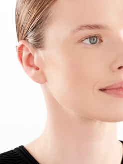 Złota nausznica z cyrkoniami