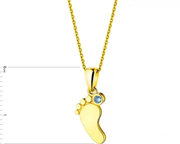 Złota zawieszka z akwamarynem syntetycznym - stópka
