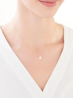 Złota zawieszka z cyrkonią