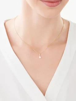 Złota zawieszka z cyrkonią - perła