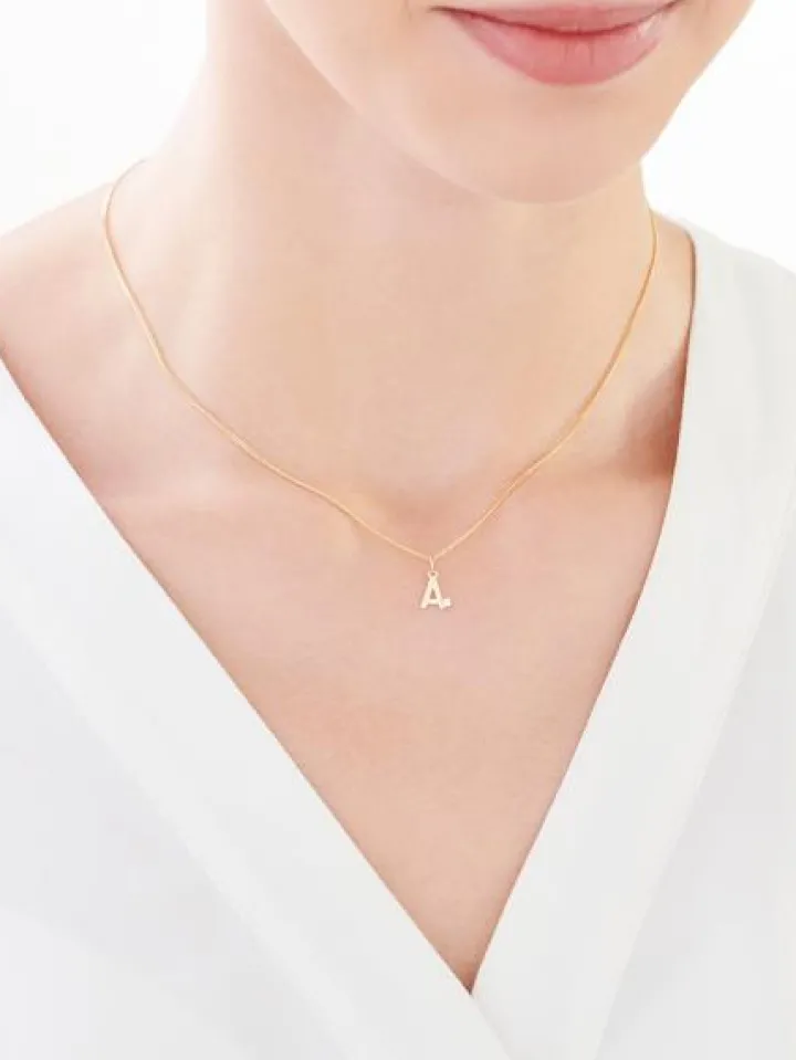 Złota zawieszka z cyrkonią - litera A