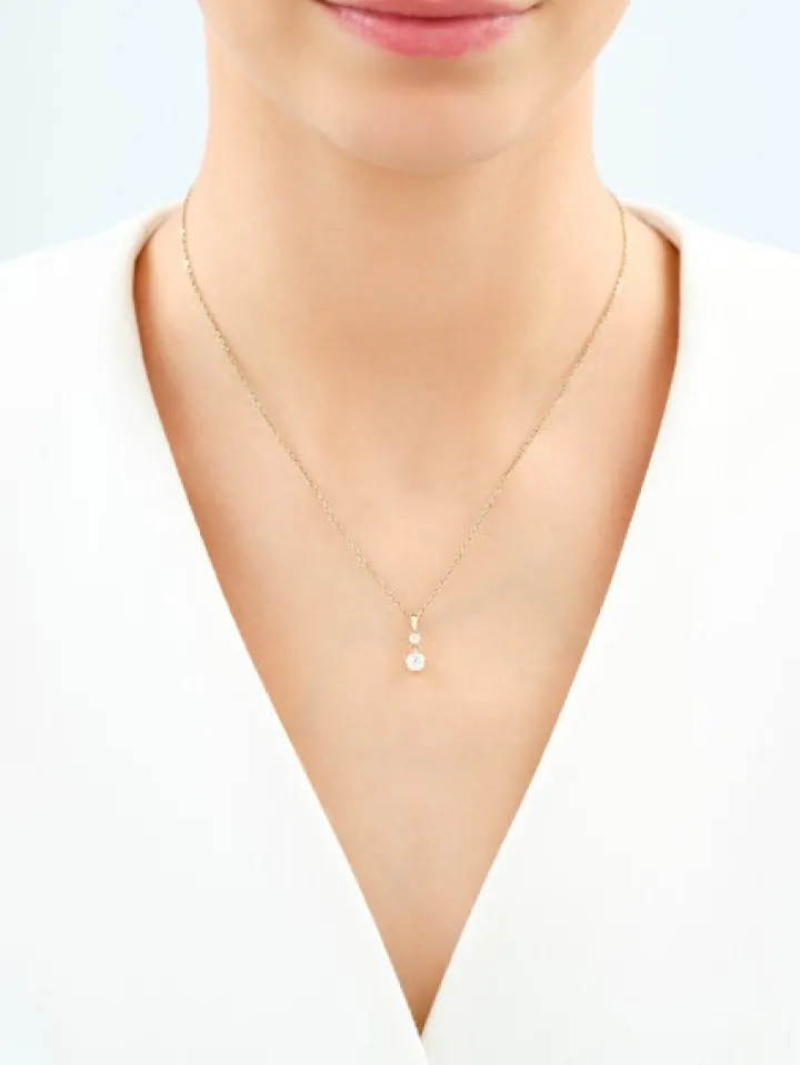 Złota zawieszka z cyrkoniami