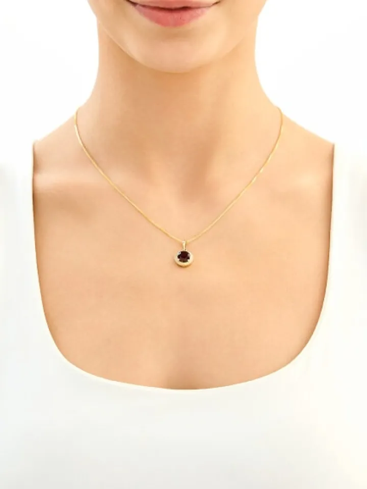 Złota zawieszka z granatem syntetycznym