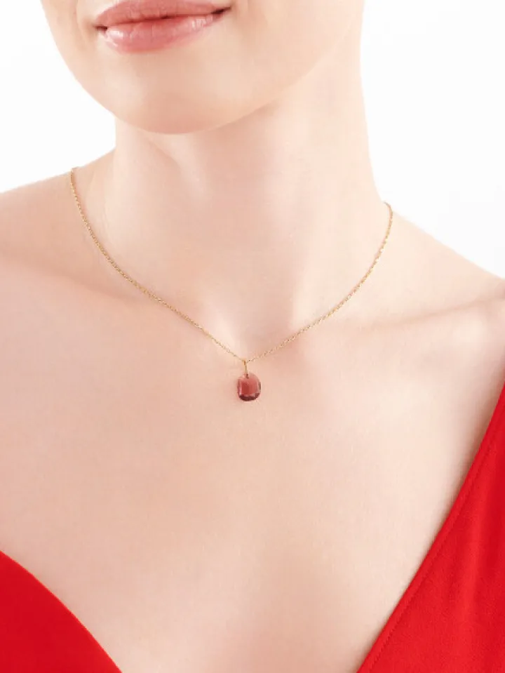 Złota zawieszka z kryształem syntetycznym