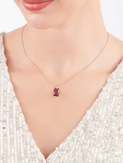 Złota zawieszka z kryształem syntetycznym