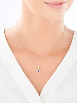 Złota zawieszka z szafirem syntetycznym i cyrkoniami